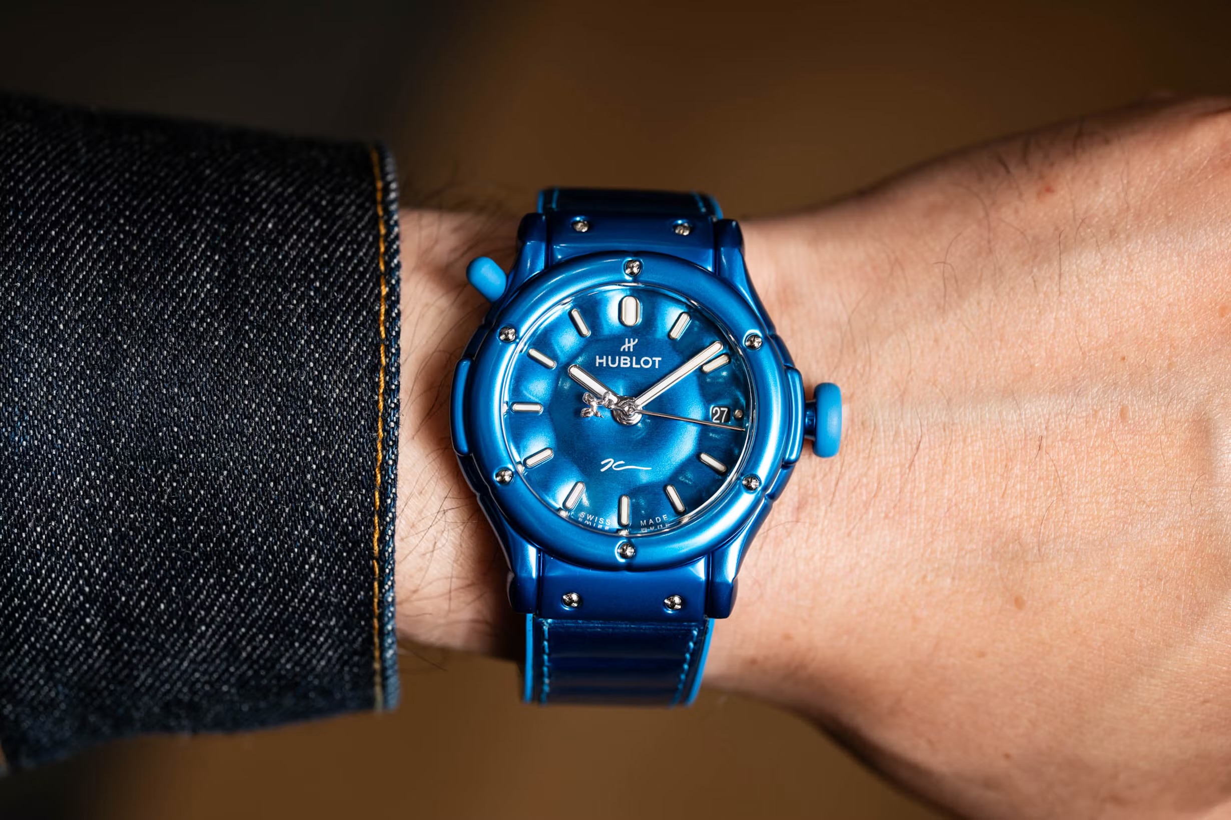 The Classic Fusion Balloon Dog in blue anodized aluminum, on the wrist