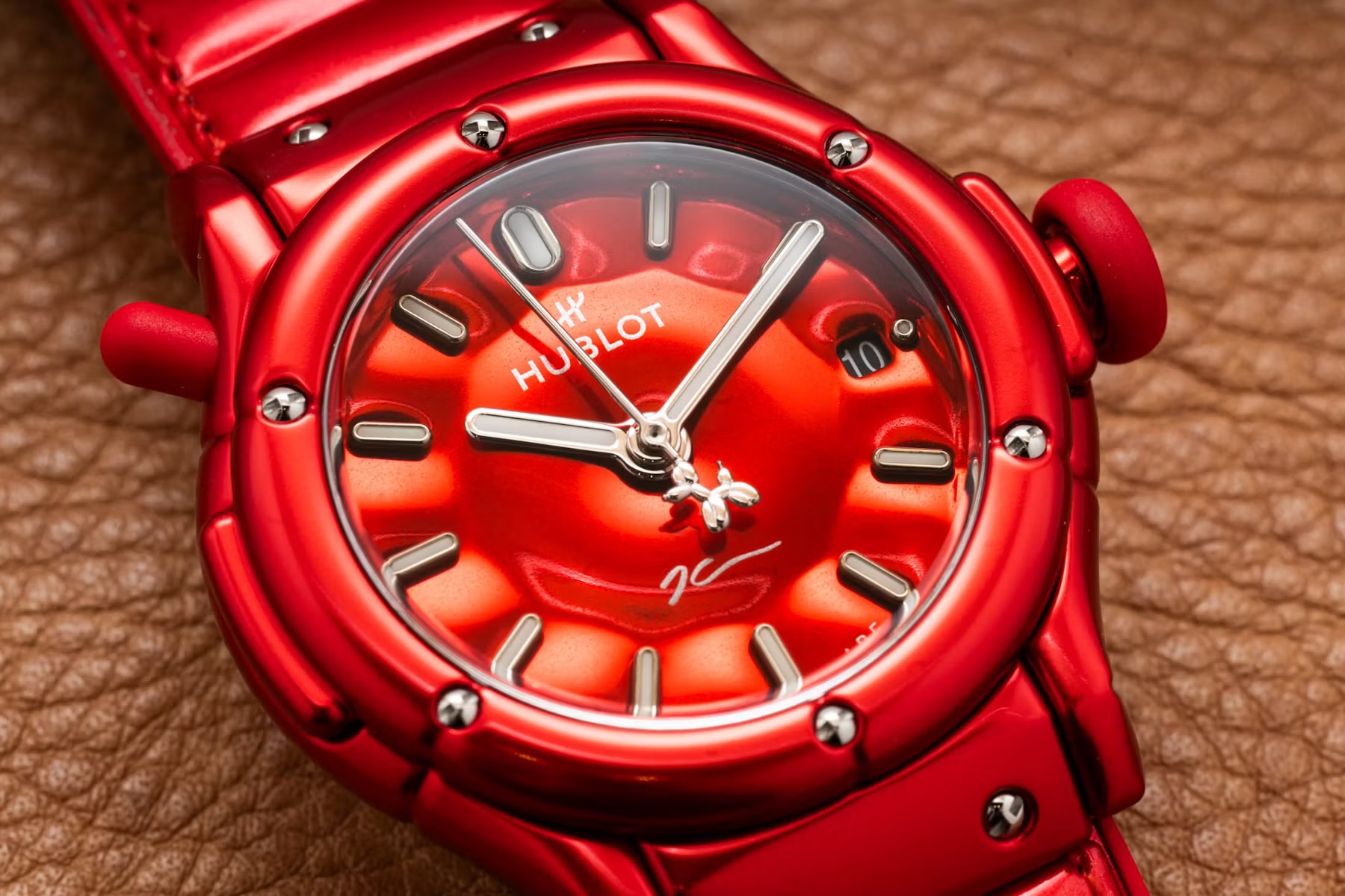 Macro of the red dial and the Balloon Dog-shaped seconds hand counterweight