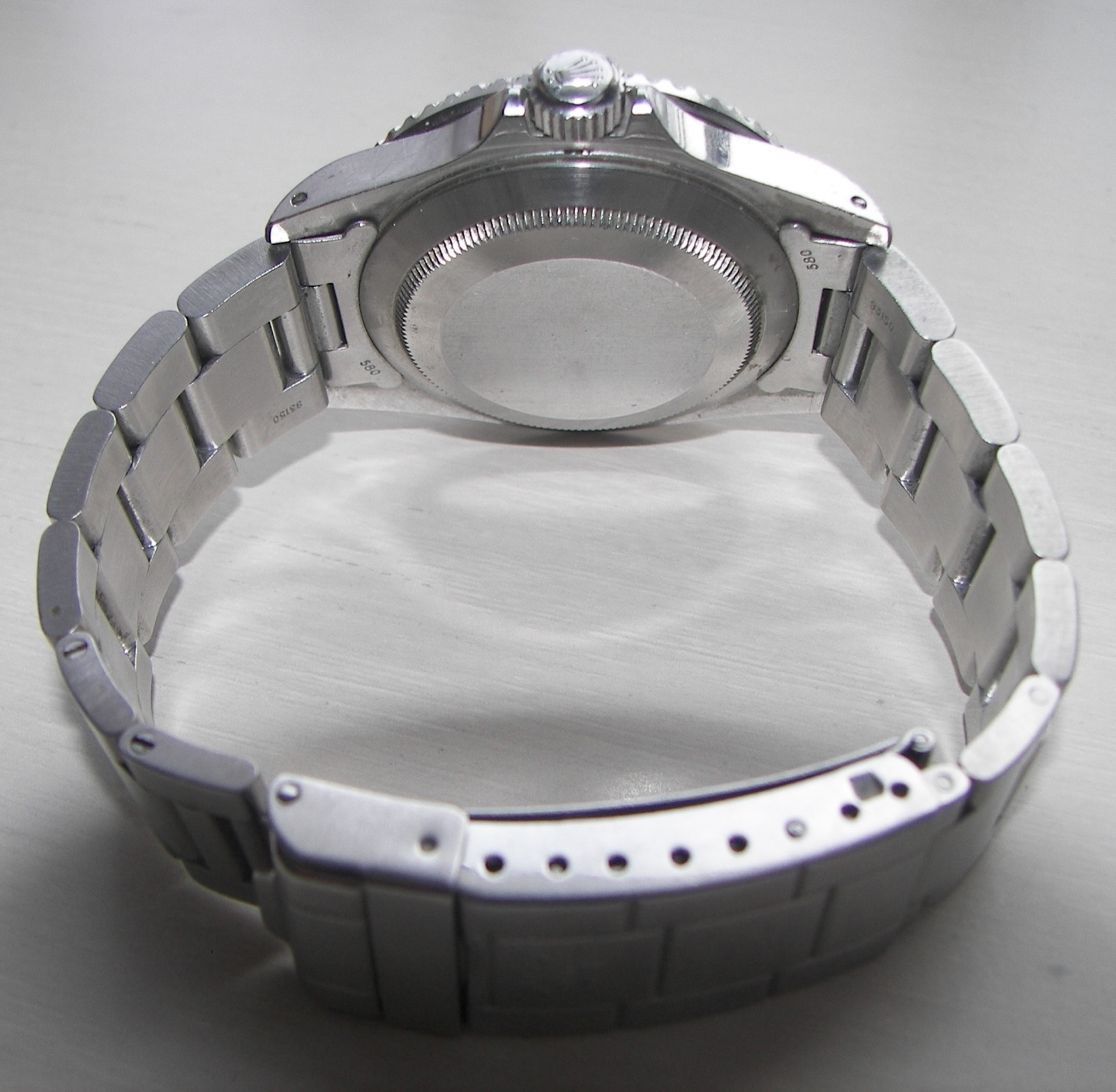 Plain solid caseback of a genuine Rolex Submariner